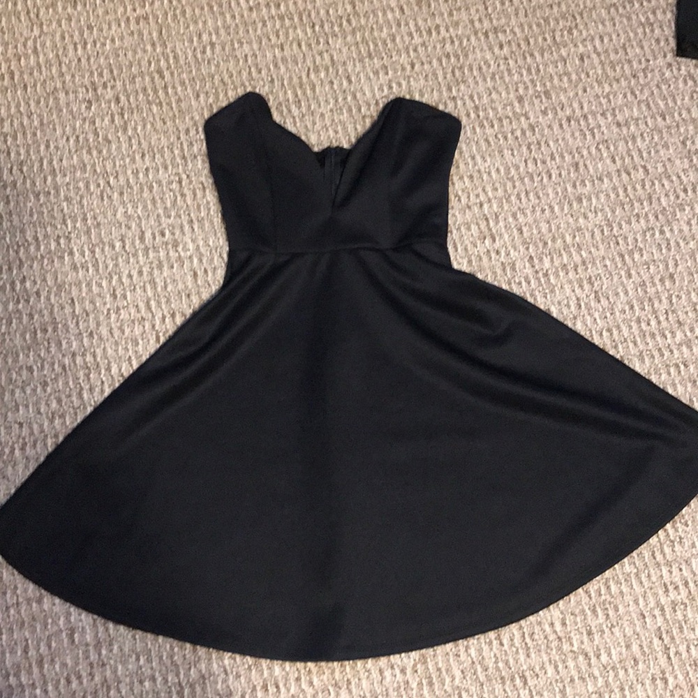 Black cocktail dress plunged V neck line